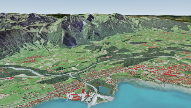 Paysage 3D virtuel représentant une montagne, des zones vertes et la côte avec des bâtiments sous forme de polygones rouges