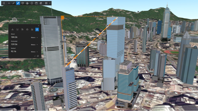 Scène 3D d’une ville avec plusieurs grands bâtiments et la mesure entre les deux bâtiments notée à l’aide d’une ligne orange et blanche
