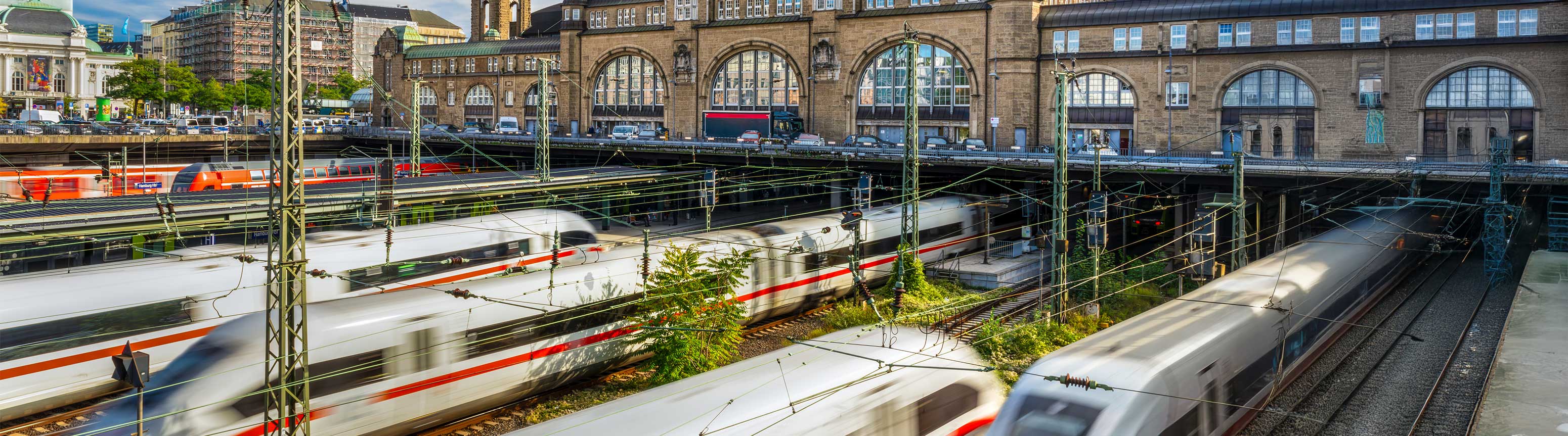 A public transportation train moving through a station