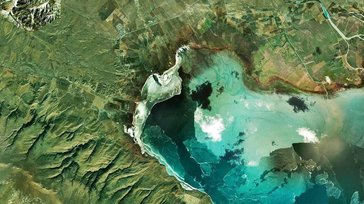 Satellite imagery of a green, mountainous coastal region