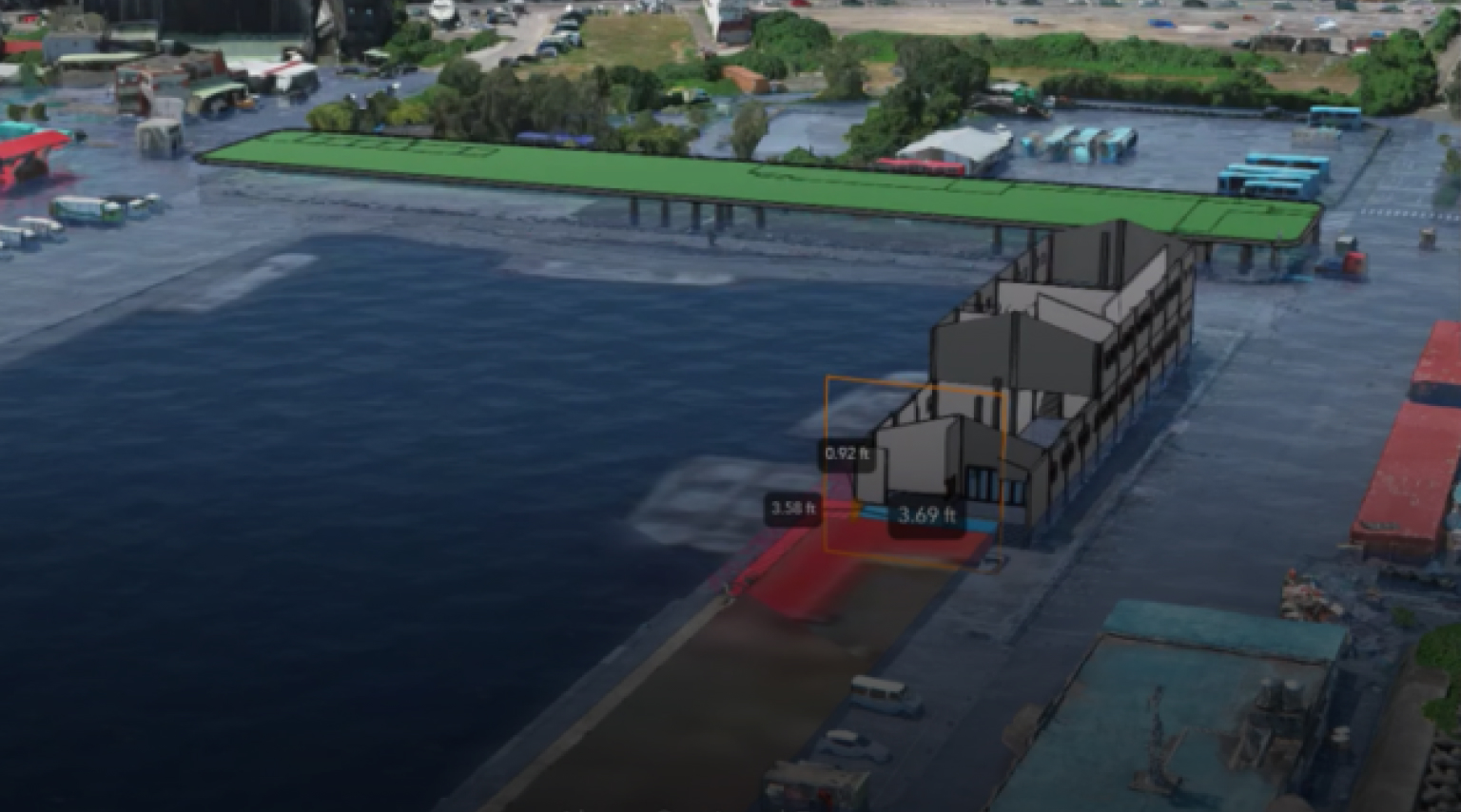Scène 3D d’un site de construction de bâtiment actif montrant un bâtiment, des véhicules et de l’eau bleue