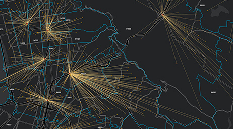 Image numérique en noir d'une masse terrestre avec des lignes de rayonnement jaunes dispersées sur la carte